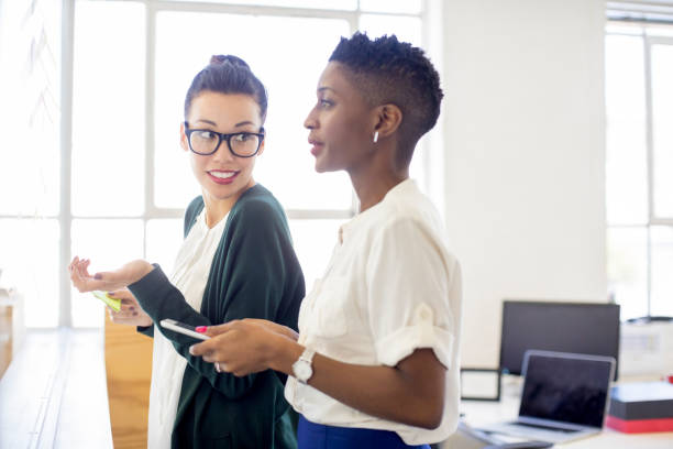 istock Multi-ethnic businesswomen discussing in office 878860368