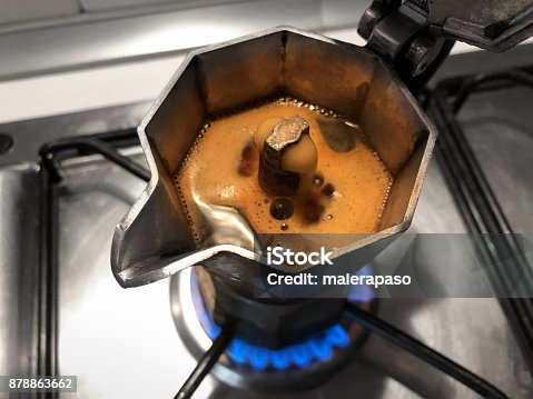 istock Moka with coffee on the stove top. Traditional italian coffee maker. 878863662
