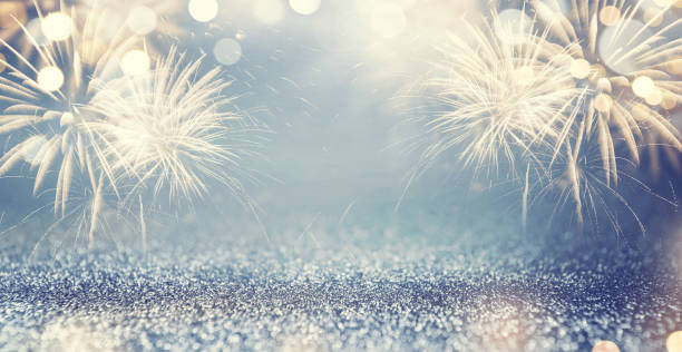 Gold Fireworks and bokeh in New Year eve and space for text. Blue Abstract background holiday. Gold Fireworks and bokeh in New Year eve and space for text. Blue Abstract background holiday. new year's eve 2019 stock pictures, royalty-free photos & images