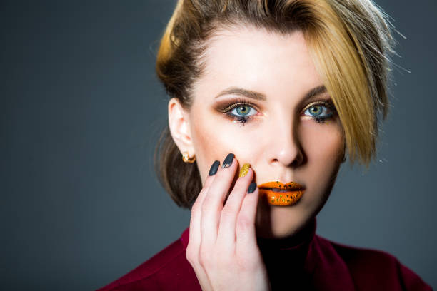istock Blonde woman with makeup and nails art 878889040