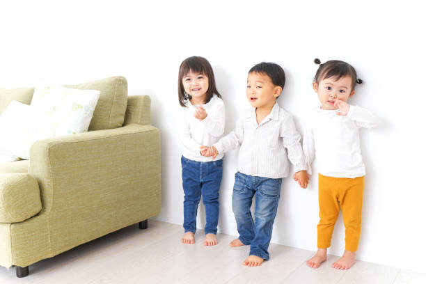 istock Children holding hands each other 878893810