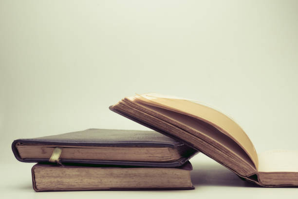 istock A stack of old books with vintage background. 878894248