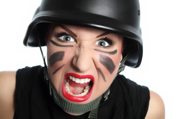 Beautiful young policewoman with face expression.