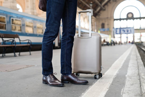 istock Mature businessman on a train station. 878898278