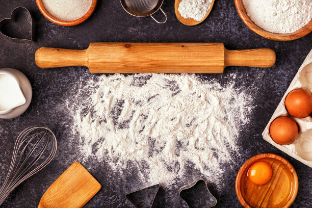istock Ingredients for baking  - flour, wooden spoon, rolling pin, eggs. 878900946
