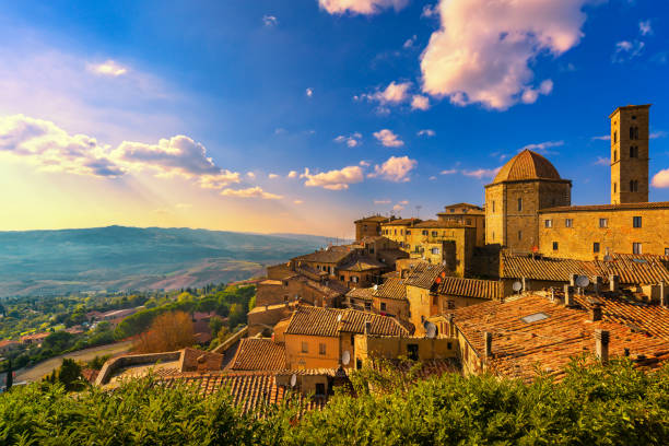 Tuscany, Volterra town skyline, church and panorama view on sunset. Italy Tuscany, Volterra town skyline, church and panorama view on sunset. Maremma, Italy, Europe pisa stock pictures, royalty-free photos & images