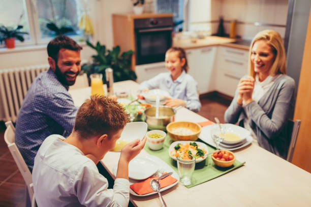istock Family On Weekend Luch At Home 878911982