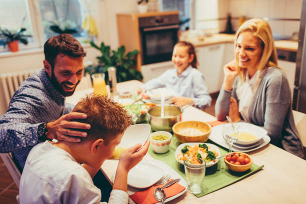 istock Family On Weekend Luch At Home 878916110