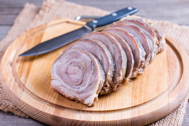 istock Sliced roasted meat roll on a wooden board 878921914