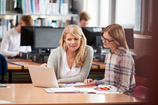 istock College Student Has Individual Tuition From Teacher In Library 878931502