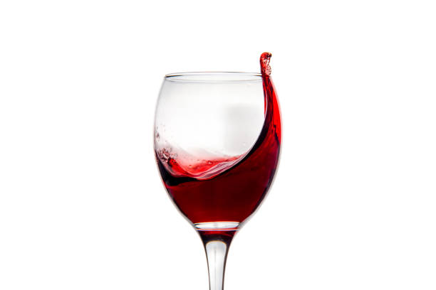 istock Wineglass with splashing drops of red wine 878941962