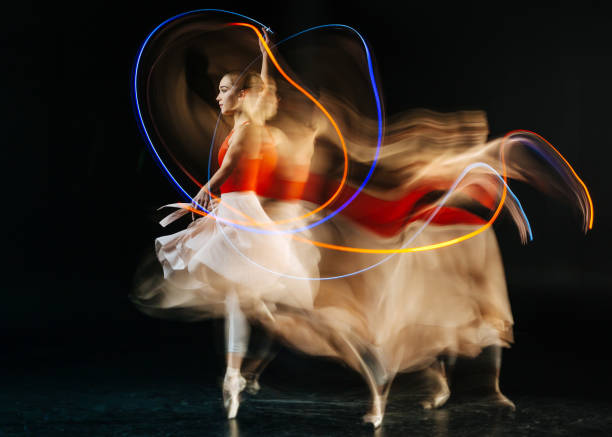 istock Attractive young woman performing a dance 878960646