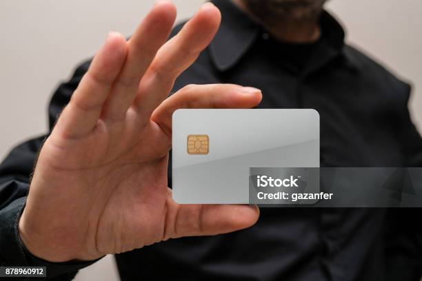 Man Holding A Blank Credit Card In Hands Stock Photo - Download Image Now - Playing Card, Template, Holding