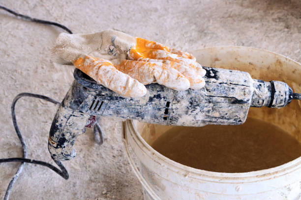 istock Plaster mixer bucket and glove 878964462