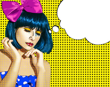Portrait of young woman in comic pop art make-up style. Female in red wig on cyan cartoon background calls by phone.\