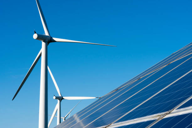 istock Solar panels and wind turbine 878969980
