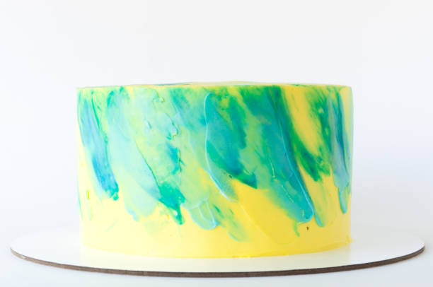 istock Cake with whipped yellow and green cream. 878972634