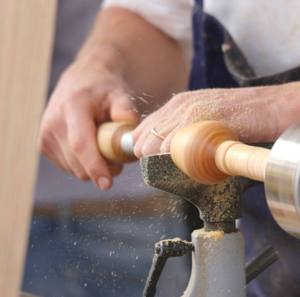 istock hand of an artisan when working with the lathe 878972726