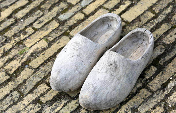 istock old Dutch clogs made in rough wood 878973136