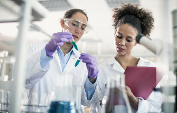 istock Two Female Scientists Working in The Laboratory 878973470