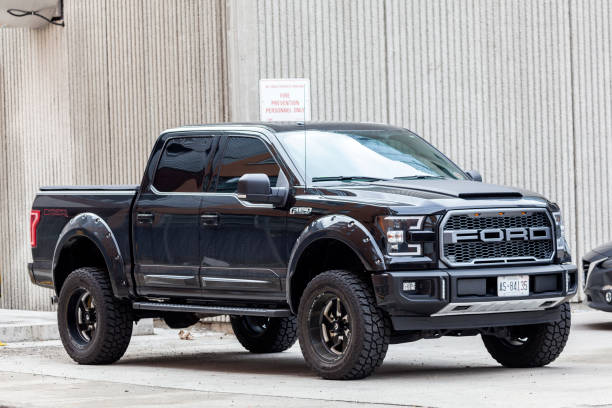 Ford F 150 SVT Raptor Toronto, Canada - Oct 14, 2017: Black Ford F 150 SVT Raptor Dakar Edition on a parking lot in the city of Toronto ford truck black stock pictures, royalty-free photos & images