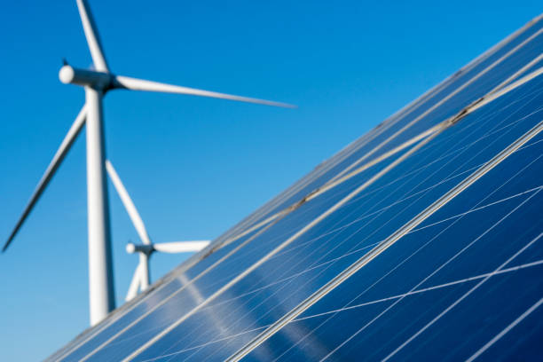 istock Solar panels and wind turbine 878976044