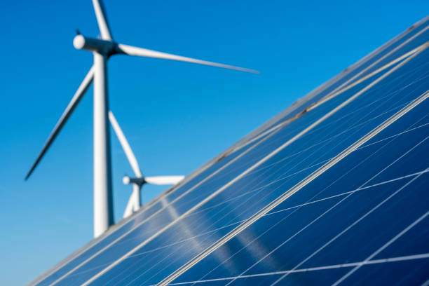 istock Solar panels and wind turbine 878980198