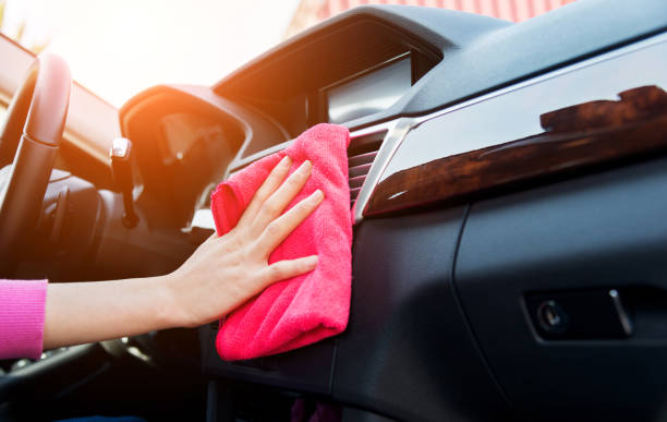 istock Woman hand cleaning car interior 878980882
