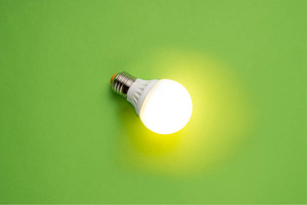 glass bulbs for lampson green background - idea concept