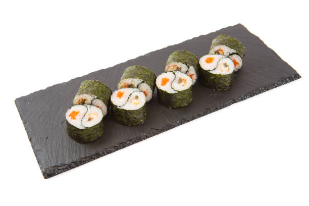istock Sushi isolated on shale food board on white background 878981730