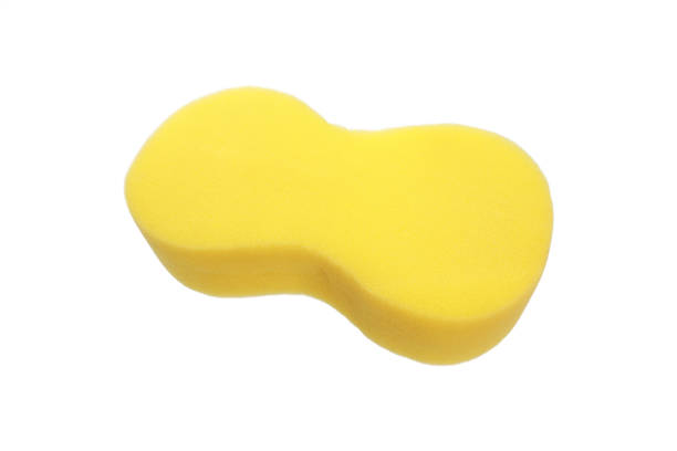 istock yellow cleaning sponge isolated on white 878994970