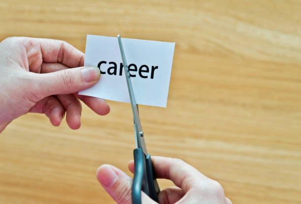istock Human hand cutting the career word 879004594