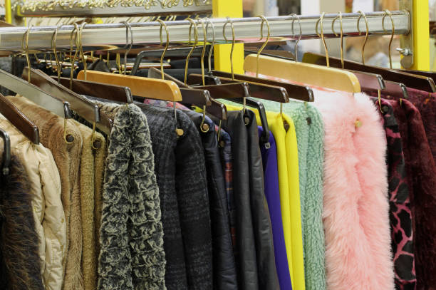 istock hooks hangers with clothes in a store 879004820