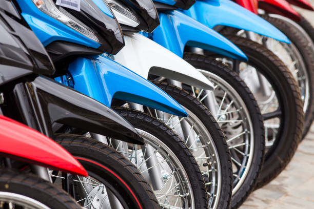 row of new motorbikes for sale stock photo