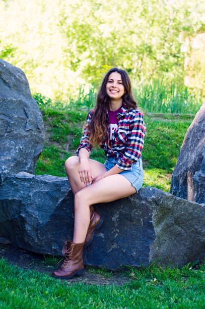 istock Young beautiful girl in the park 879009130