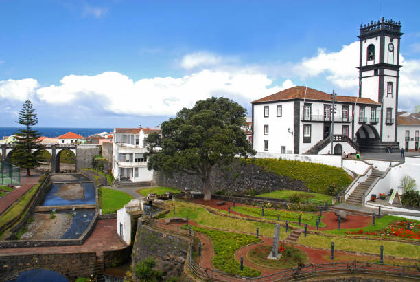 istock River park and old arched bridge in Ribeira Grande 879012102