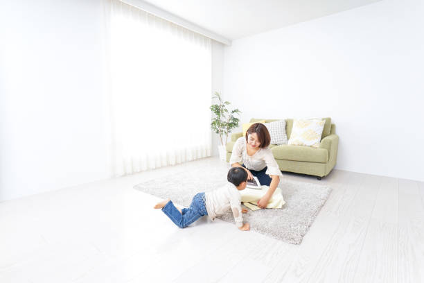 istock Mother doing household chores and child 879015784
