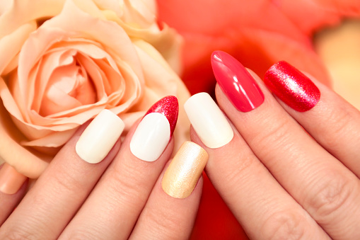 Cosmetics: Nail Polish and Rose Isolated on White Background