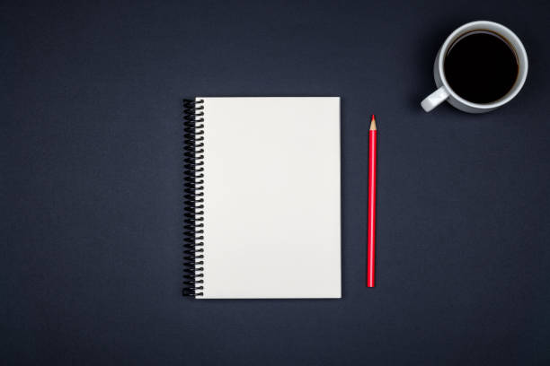 istock Top view of open spiral blank notebook on colorful desk background 879028508