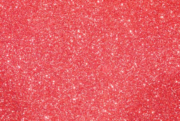 istock shiny glitter RED  background with glare of lights 879028554