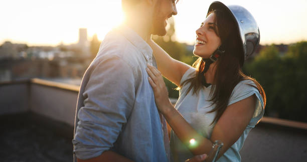 istock Beautiful couple in love dating outdoors and smiling 879028570