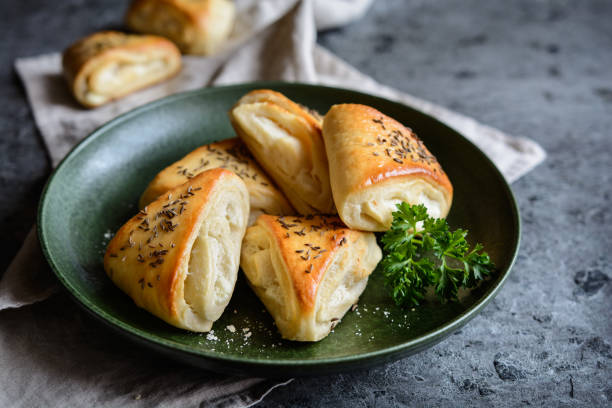 istock Baked rolls with sheep milk cheese filling 879028698