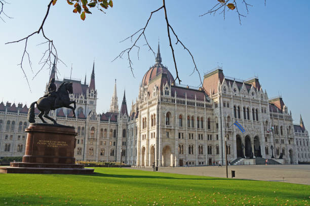 istock Hungarian Parliament is surrounded by an autumn park. 879031200
