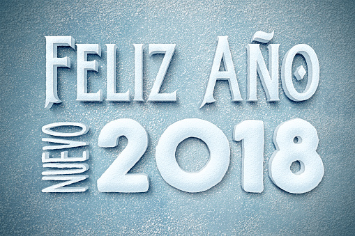 New Year 2018 in spanish built ouf of snow in winter scene Feliz año