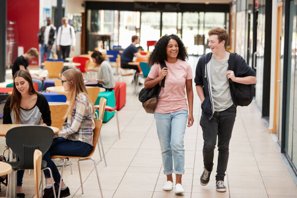 istock Communal Area Of Busy College Campus With Students 879043882