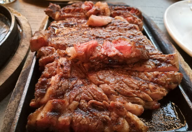 istock Dry aged 45 days medium french angus beef steak on hot plate 879044198