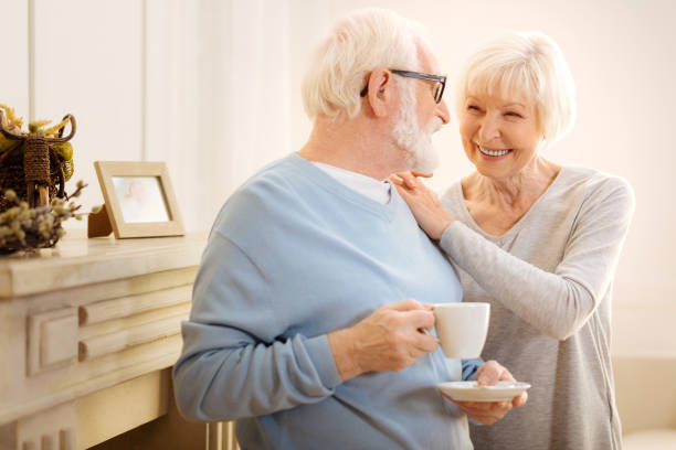 istock Beautiful senior woman talking to her man 879047702