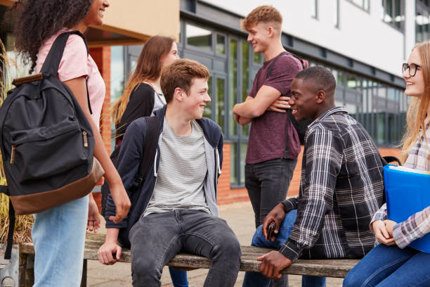 istock Student Group Socializing Outside College Buildings 879048104
