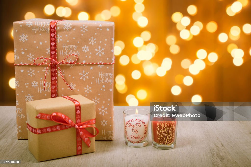 Christmas gift and candles over a wood background Advent Stock Photo