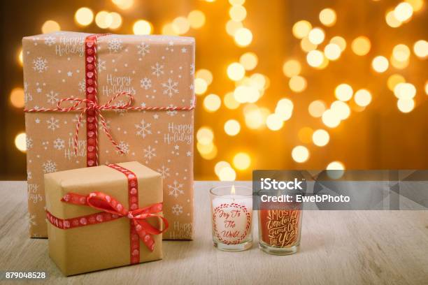 Christmas Gift And Candles Over A Wood Background Stock Photo - Download Image Now - Advent, Beauty, Bright